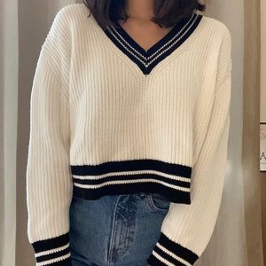 white and black varsity style sweater